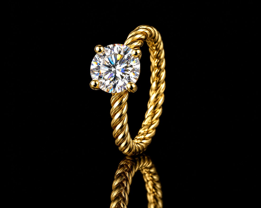 Round brilliant diamond solitaire on a twisted rope band in yellow gold