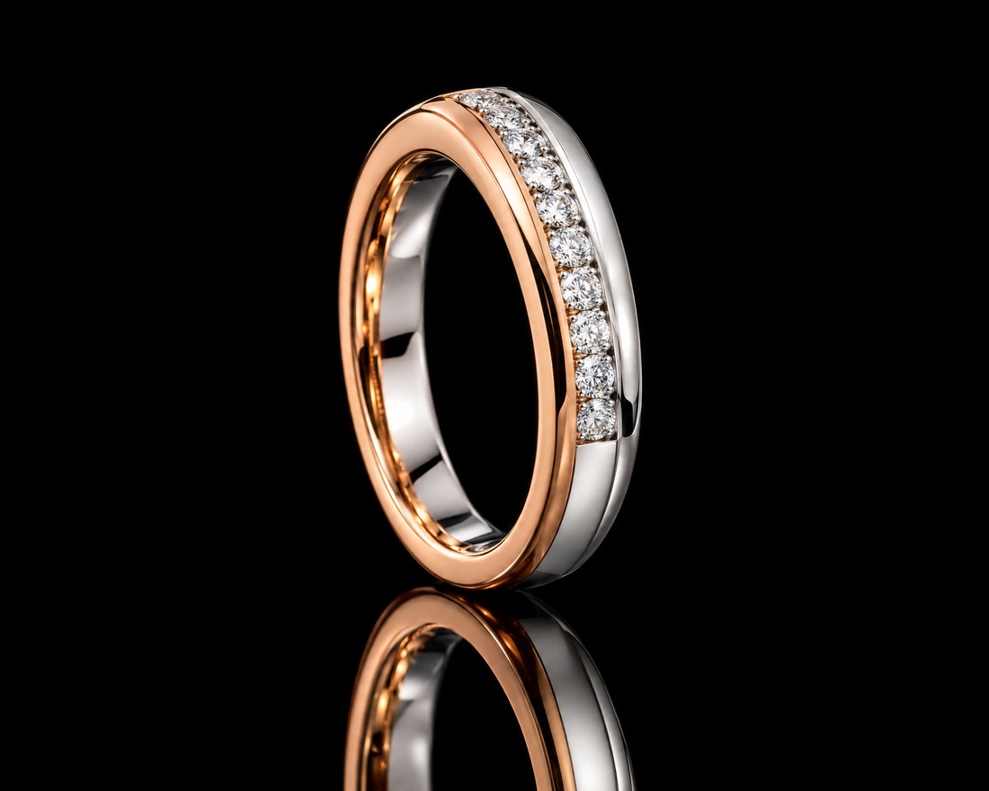 Two-tone rose and white gold band with a channel of diamonds
